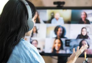 Lady on computer teams call to team mates