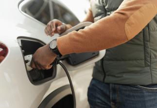 Man charging his EV car