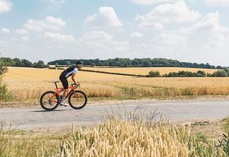 Man cycling on country road