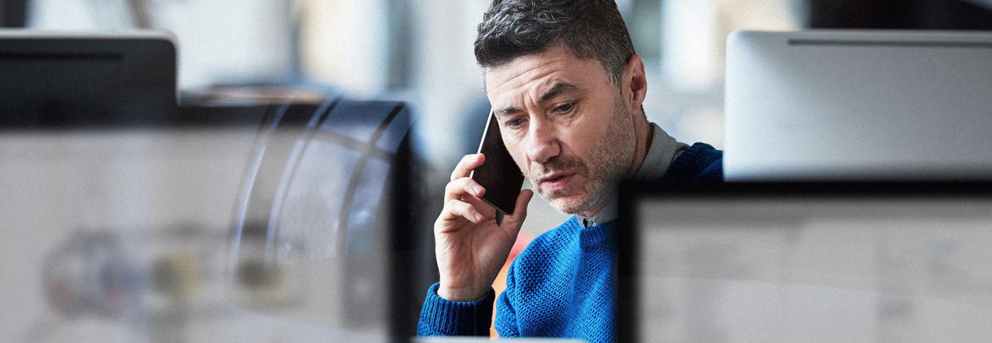 Man on his mobile phone in office