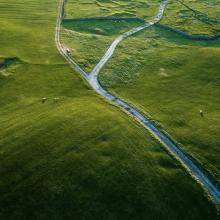 Ariel shot of field with single track country roads