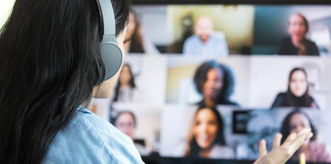 Lady on computer teams call to team mates