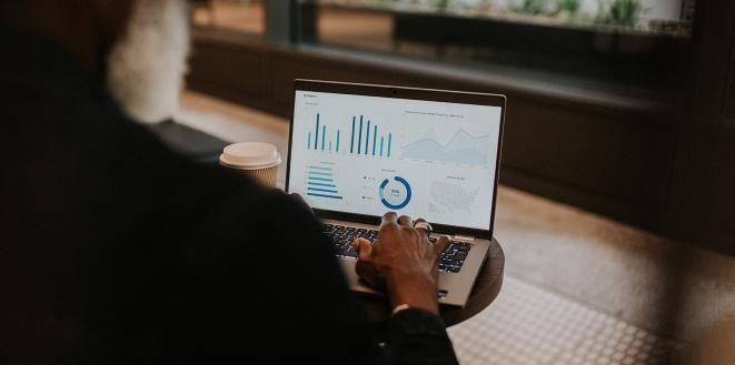 Person working on laptop looking at analytics