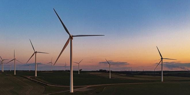 Wind turbines in the sunrise