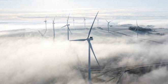 Wind turbines on a frosty and foggy morning