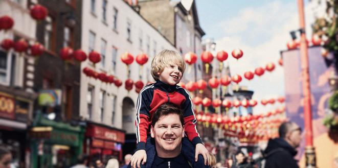 Dad with son on shoulders