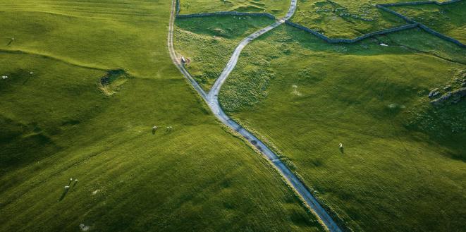 Single track country road through fields photo taken from above