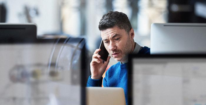 Man on his mobile phone in office