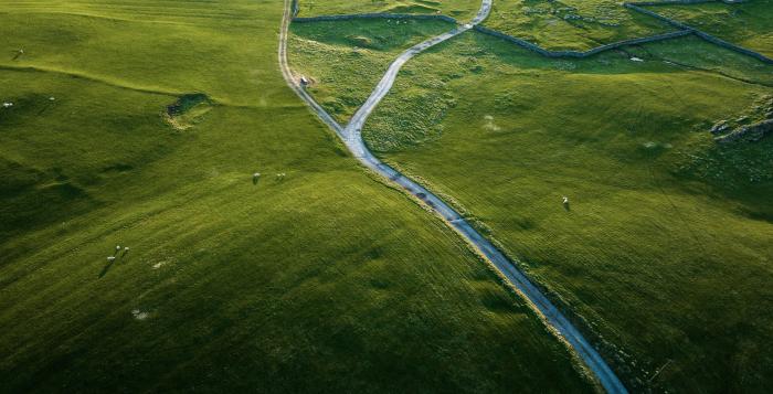 Ariel shot of field with single track country roads