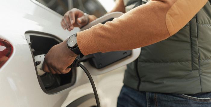 Man charging his EV car