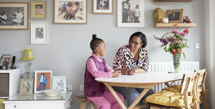 Mum and daughter doing homework in their kitchen