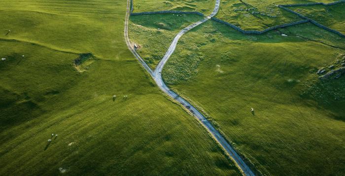 Single track country road through fields photo taken from above